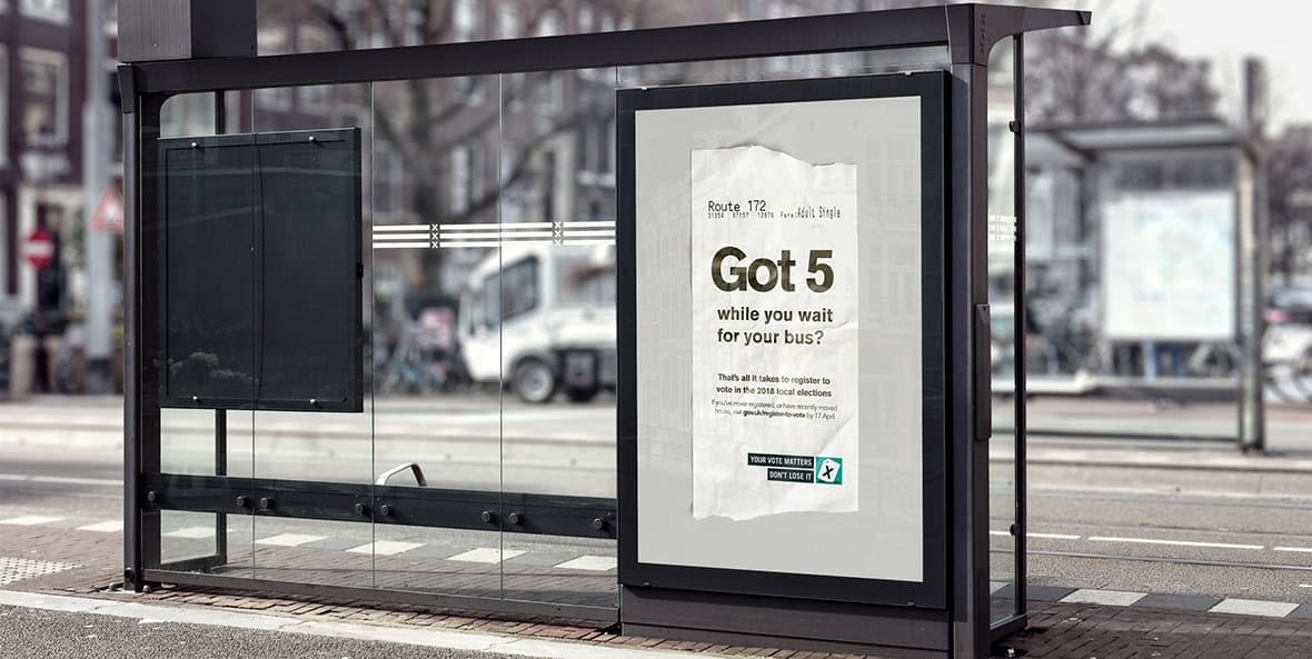 Bus shelter with poster showing Got 5 while you wait for your bus? That's all it takes to register to vote in the 2018 local elections.