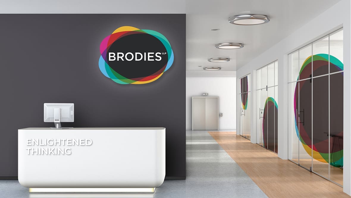 Brodies logo on a reception wall mock up.